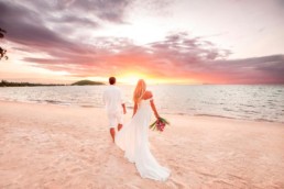 Couple on a beach at a destination wedding